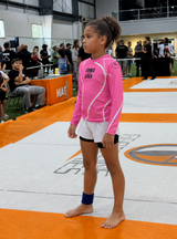 Pink Roll Gear long sleeve rash guard for girls
