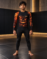 Roll Gear Youth Tap or Treat Long Sleeve Rash Guard, front view, worn by a young male athlete.