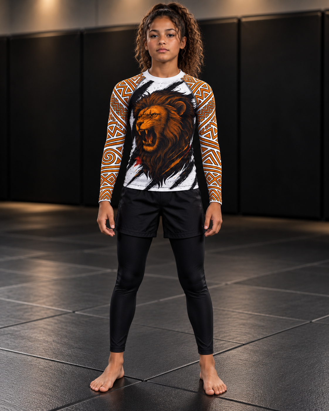 Roll Gear Lion’s Pride Long Sleeve Rash Guard – White & Gold – Youth, front view on a teen girl, lion chest graphic.