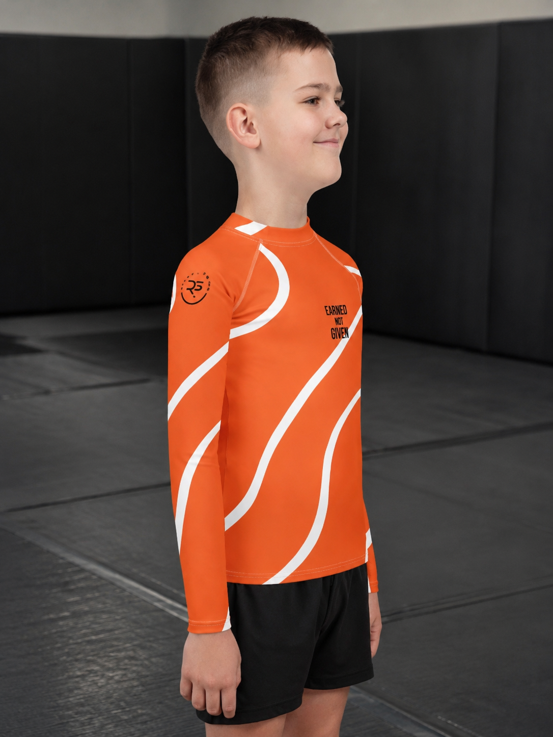 Roll Gear Orange Swirl Rash Guard - Orange/White, Kids, lifestyle photo, additional angle.