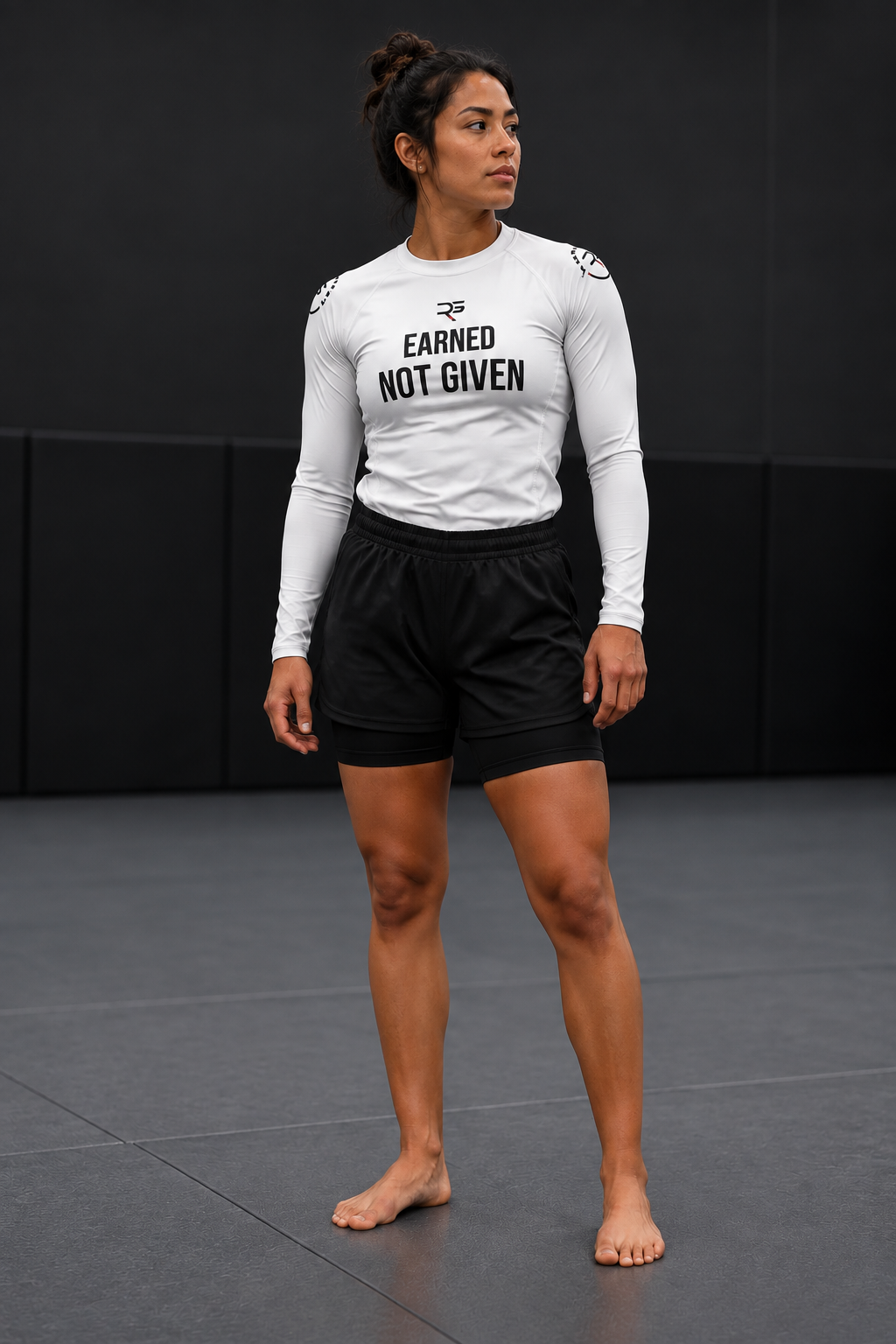 Roll Gear Excuses Don’t Burn Calories rash guard and women's 2-in-1 grappling shorts, front view on the mat.