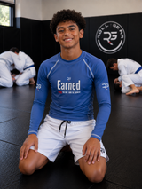 Roll Gear Earned Not Given Long Sleeve Rash Guard - Blue, Youth, product photo.