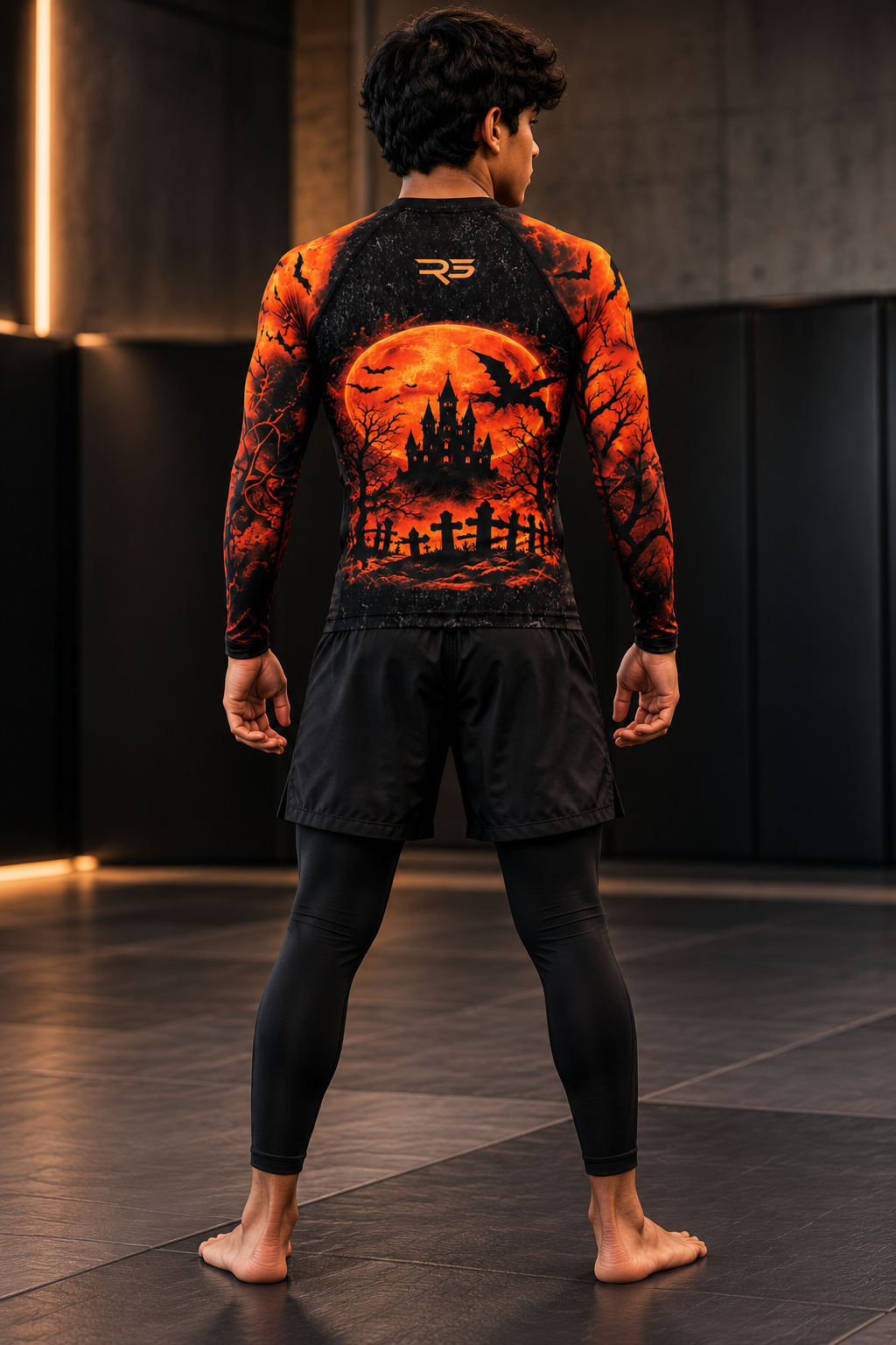 Roll Gear Youth Tap or Treat Long Sleeve Rash Guard, back view, haunted house back print.