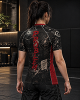 Roll Gear I'm the Problem Short Sleeve Rash Guard – Adult Unisex, back view, female athlete.