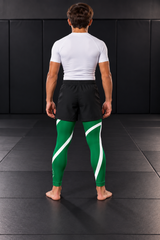 Roll Gear Green Swirl Spats – Green/White – Youth, back view on a teen boy.