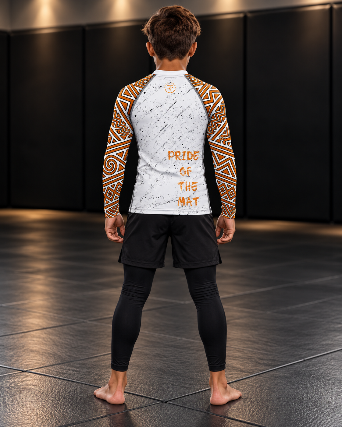 Roll Gear Lion’s Pride Long Sleeve Rash Guard – White & Gold – Youth, back view on a teen boy, back print.