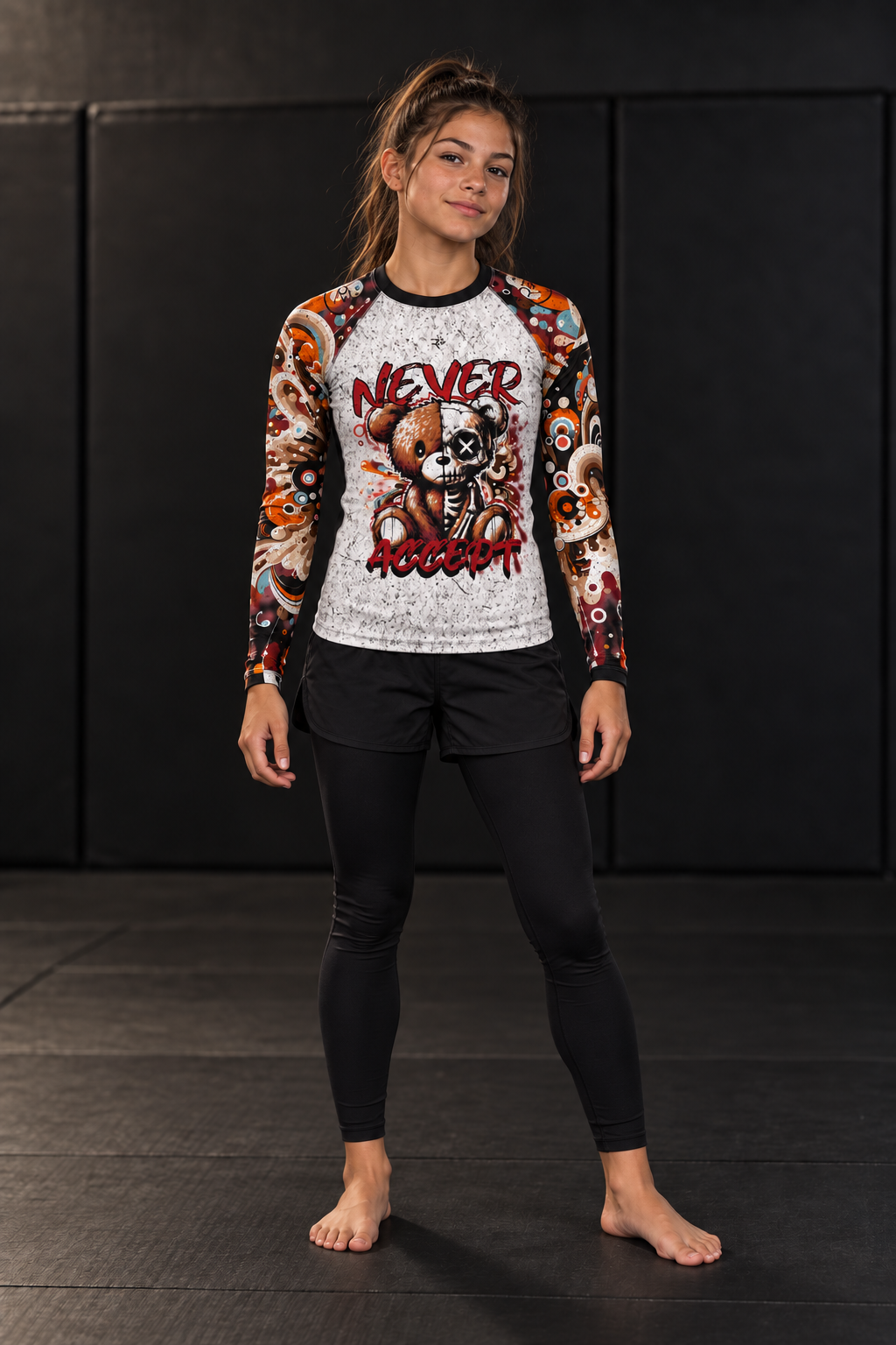 Roll Gear Never Accept Rash Guard – Black – Youth, front view, worn by a young athlete on the mat.