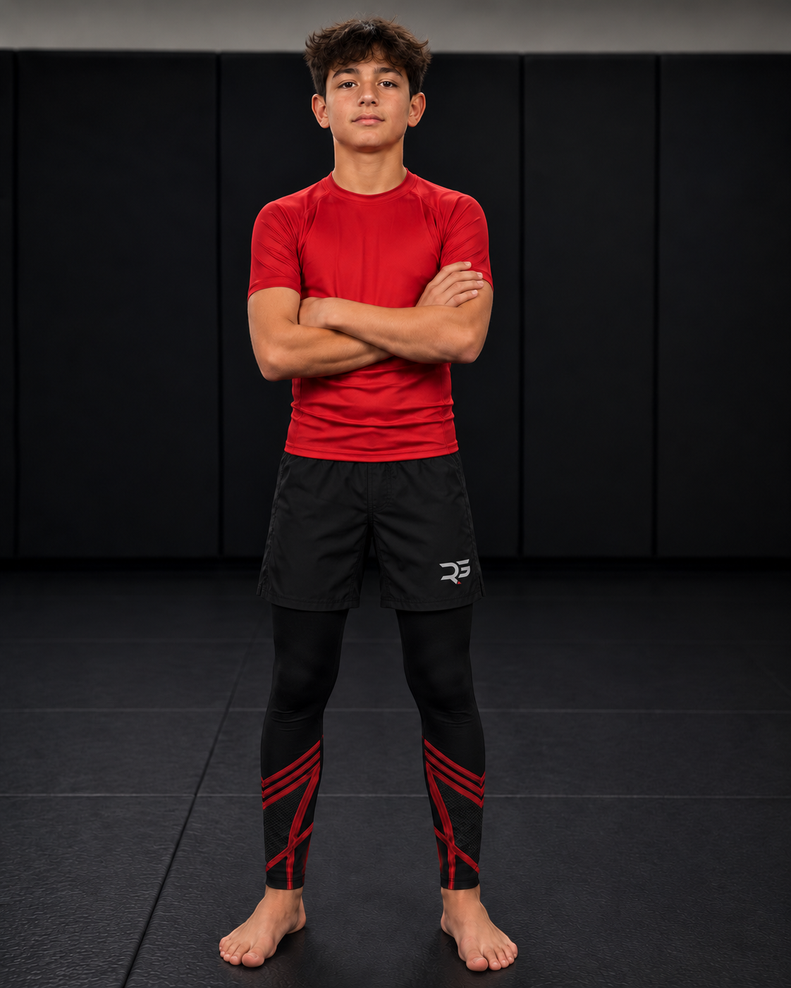 Roll Gear Youth Marines Dress Blues Compression Spats, worn under shorts by a youth athlete on the mat.