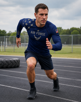 Man running on a track wearing an Air Force t-shirt with American flag design.