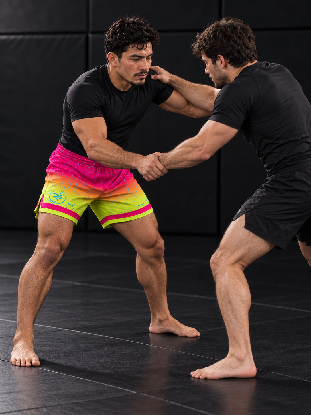 Roll Gear Neon Lava Grappling Shorts – Men's, worn during standing grip fighting on the mat.
