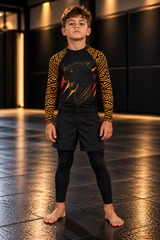 Roll Gear Jaguar Kids BJJ Rash Guard, front view on a boy.