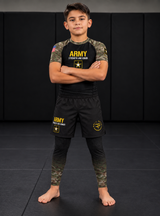 Roll Gear Youth Army Classic Compression Spats, worn with Army shorts and rash guard on the mat.
