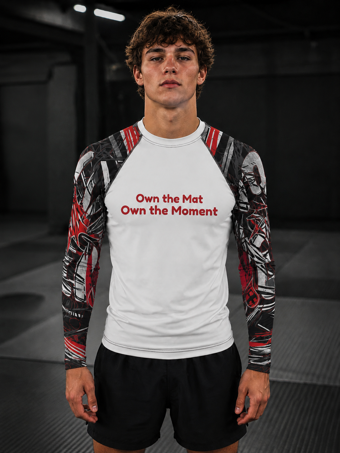 Roll Gear Evolve or Repeat Youth Boys Rash Guard – White & Red, front view, Own the Mat Own the Moment chest text.