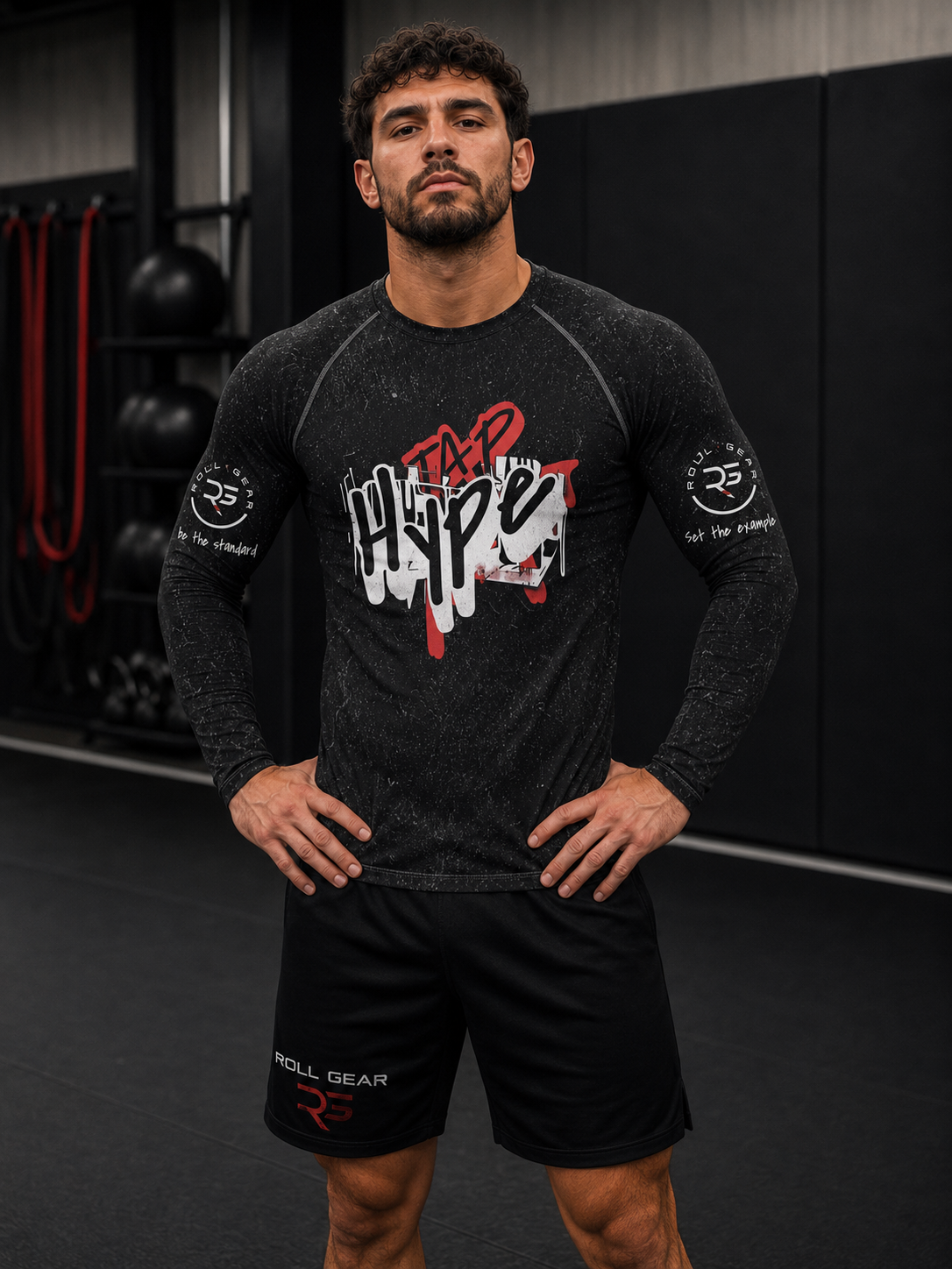 Roll Gear Tap Hype Rash Guard, front view, hands on hips, worn in the gym.