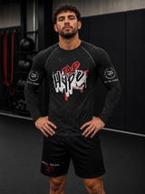 Roll Gear Tap Hype Rash Guard, front view, hands on hips, worn in the gym.