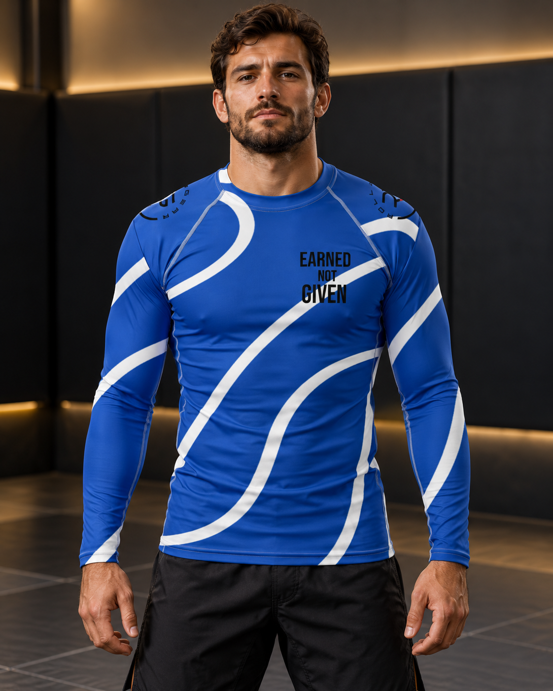 Roll Gear Blue Swirl Long Sleeve Rash Guard – Blue/White – Men’s, front view on a man standing on the mat.