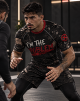 Roll Gear I'm the Problem Short Sleeve Rash Guard – Adult Unisex, worn in a grappling stance.