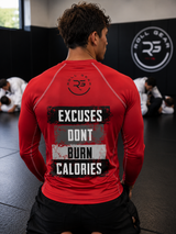 Roll Gear Excuses Don’t Burn Calories Rash Guard – Red – Men’s, back view, Excuses back print, seated on the mat.