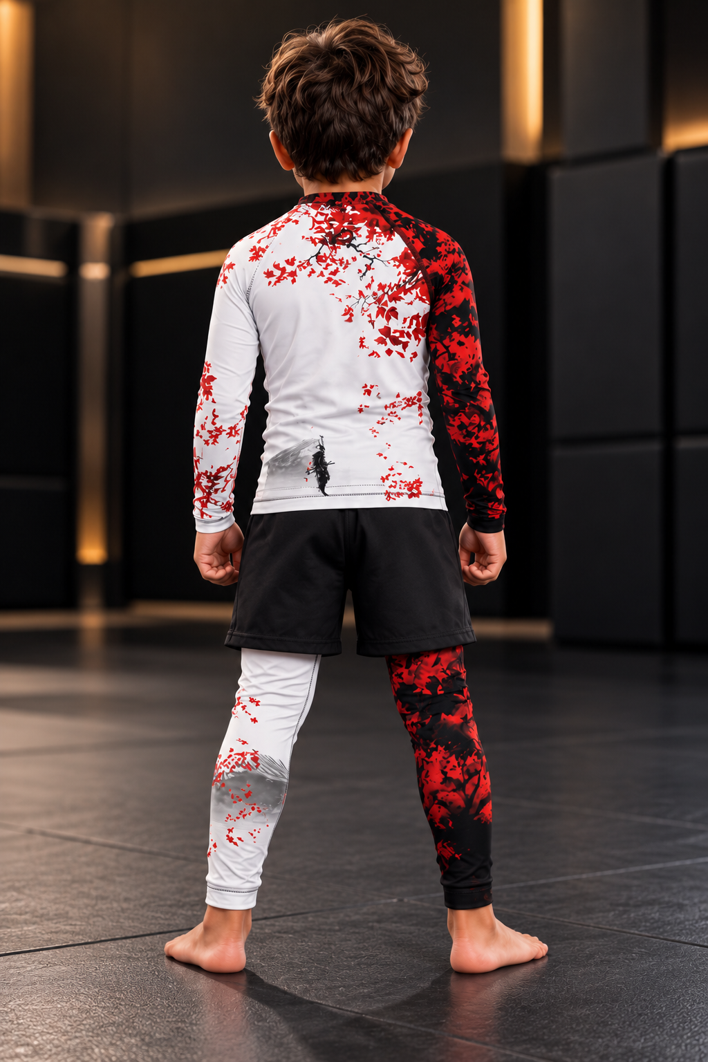 Roll Gear Shadow Dragon Warrior Kids Rash Guard and Spats – White & Crimson, boy standing on the mat, back view.