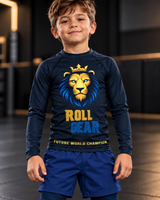 Roll Gear Kids Lion Rash Guard – Future World Champion, smiling boy close-up, lion graphic.