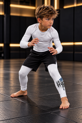 Roll Gear Tap Hype Spats – Blue & White – Boys Kids, young boy in a fighting stance on the mat.