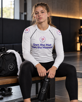 Roll Gear Evolve or Repeat Youth Girls Rash Guard – White, worn by a young athlete seated in the gym.