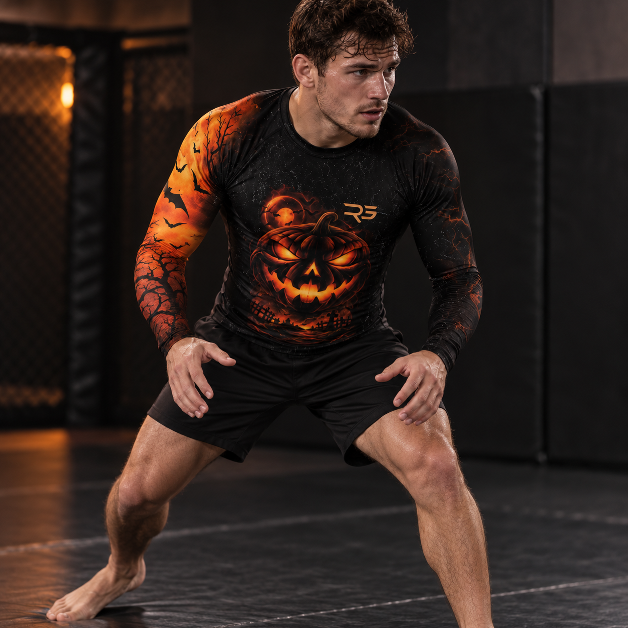 Roll Gear Men's Tap or Treat Long Sleeve Rash Guard, man in a crouched stance on the mat.