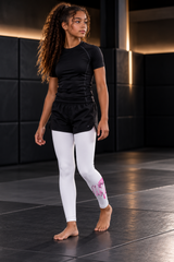 Roll Gear Tap Hype Spats – Pink & White – Youth Girls, teen girl walking across the mat.
