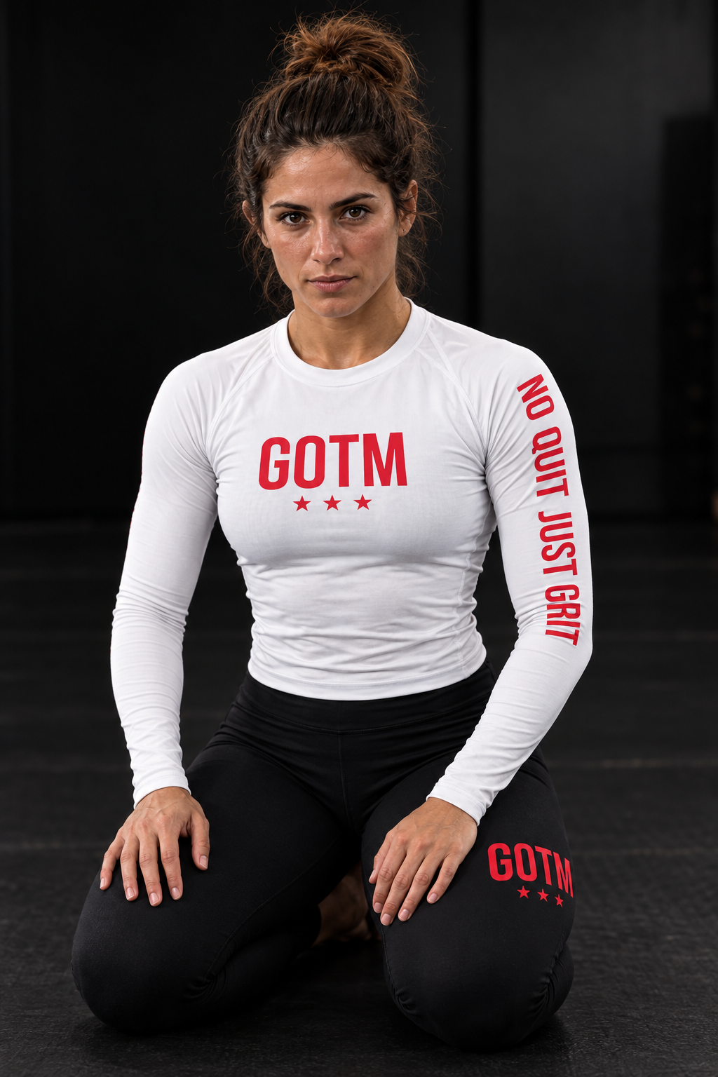 Roll Gear Women’s Girls on the Mat BJJ Rash Guard – White Edition, worn while drilling, No Quit Just Grit sleeve text.