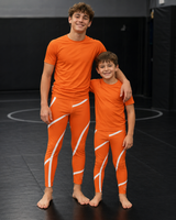 Roll Gear Orange Swirl Spats - Orange/White, product photo.