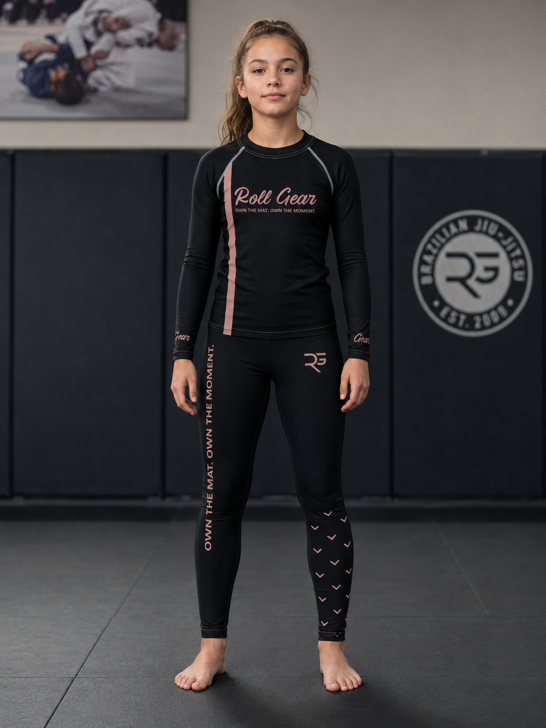 Roll Gear Girls Bows Long Sleeve Rash Guard – Pink – Youth, full-length front view, worn on the mat.