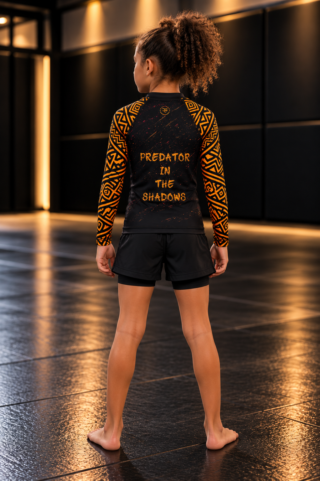 Roll Gear Jaguar Kids BJJ Rash Guard, back view on a girl, back print.