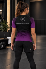 Roll Gear Fade Short Sleeve Rash Guard – Adult, back view on a woman, Own the Mat. Own the Moment. text.