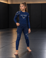 Roll Gear Kids Air Force Compression Spats – Navy, front view on a girl in the matching rash guard.