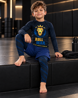 Roll Gear Kids Lion Spats — Future World Champion Collection, boy seated on a gym bench in the matching set.