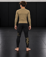 Roll Gear Youth Marines Gold Compression Spats, back view on a teen athlete.