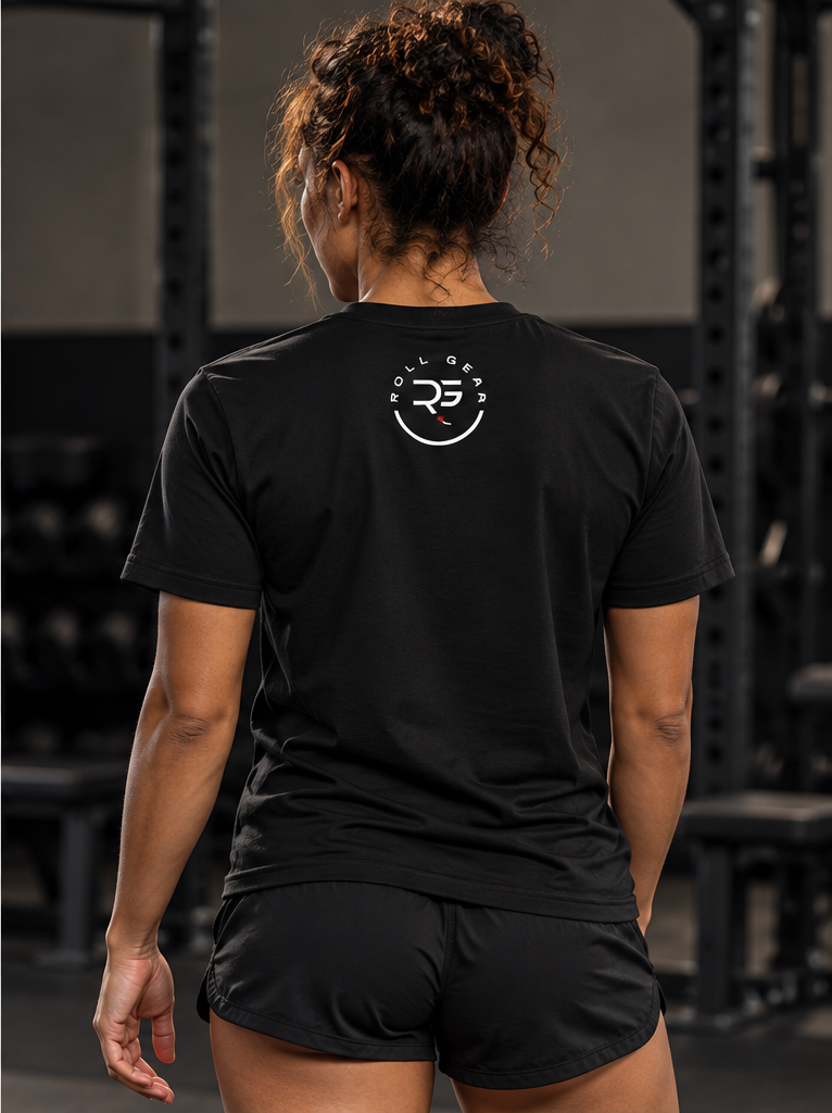 Roll Gear Women's Earned Not Given Motivational T-Shirt, back view, worn by the squat rack.