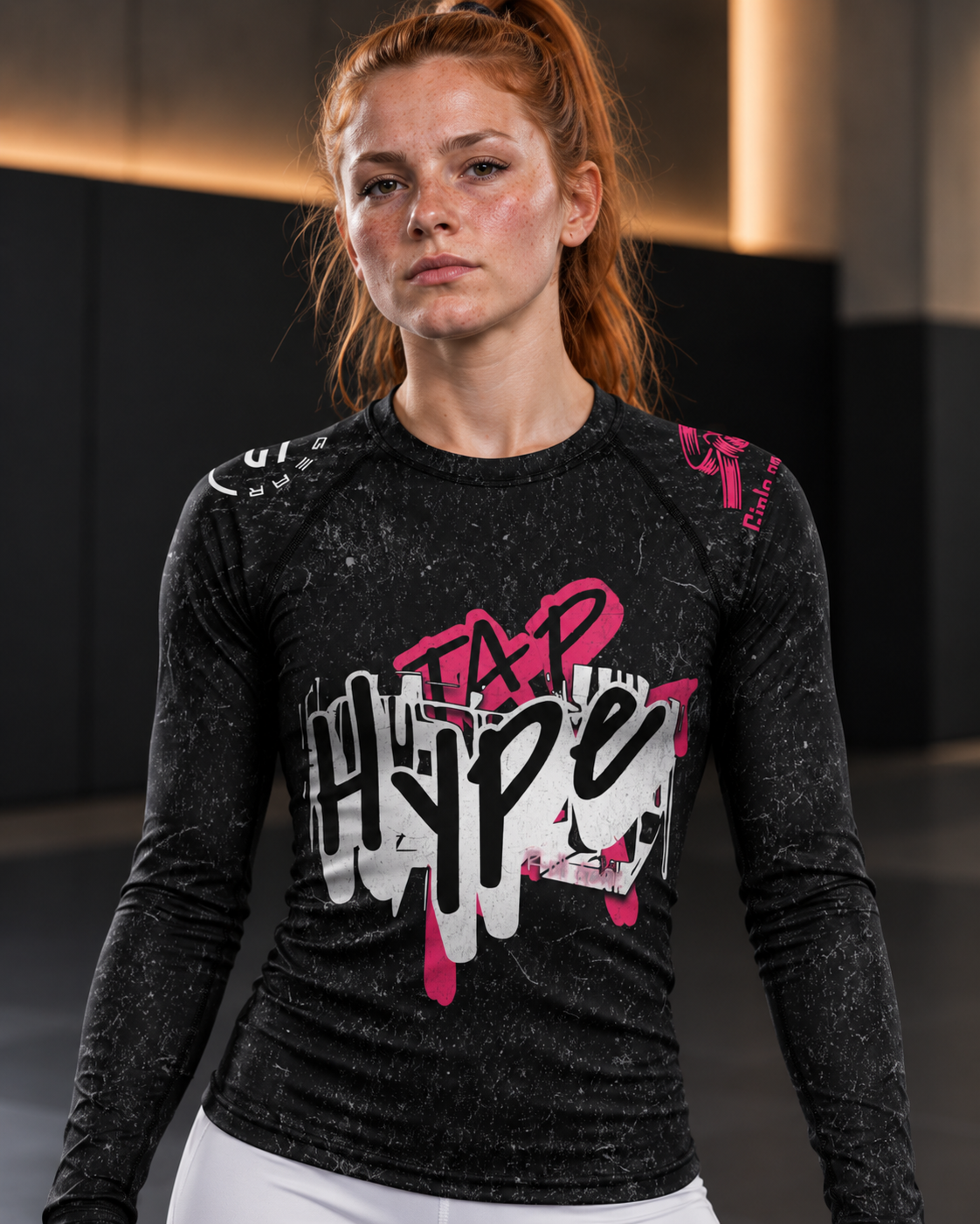 Roll Gear Tap Hype – Pink Edition Long-Sleeve BJJ Rash Guard, close-up of the Tap Hype chest graphic.