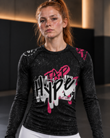 Roll Gear Tap Hype – Pink Edition Long-Sleeve BJJ Rash Guard, close-up of the Tap Hype chest graphic.