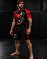 Roll Gear Embrace the Dark Short Sleeve Rash Guard, man standing on the mat, front view.