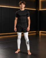 Roll Gear Tap Hype Spats – Blue & White – Youth, front view on a teen boy.