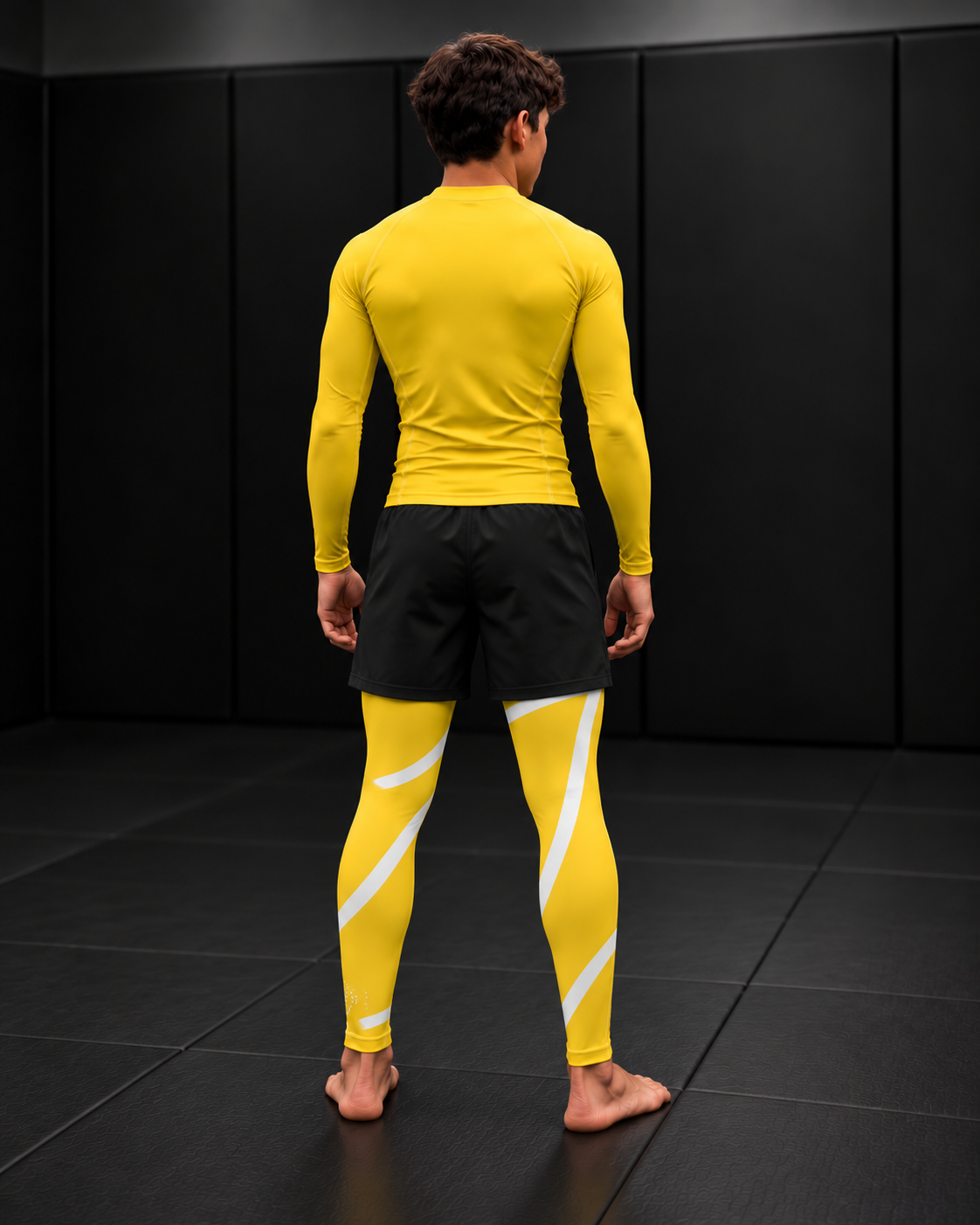 Roll Gear Yellow Swirl Spats – Yellow/White – Youth, back view on a teen boy.