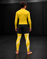 Roll Gear Yellow Swirl Spats – Yellow/White – Youth, back view on a teen boy.