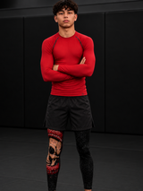 Roll Gear Cold Blooded Spats – Black Venom, worn with a red rash guard by a man on the mat.