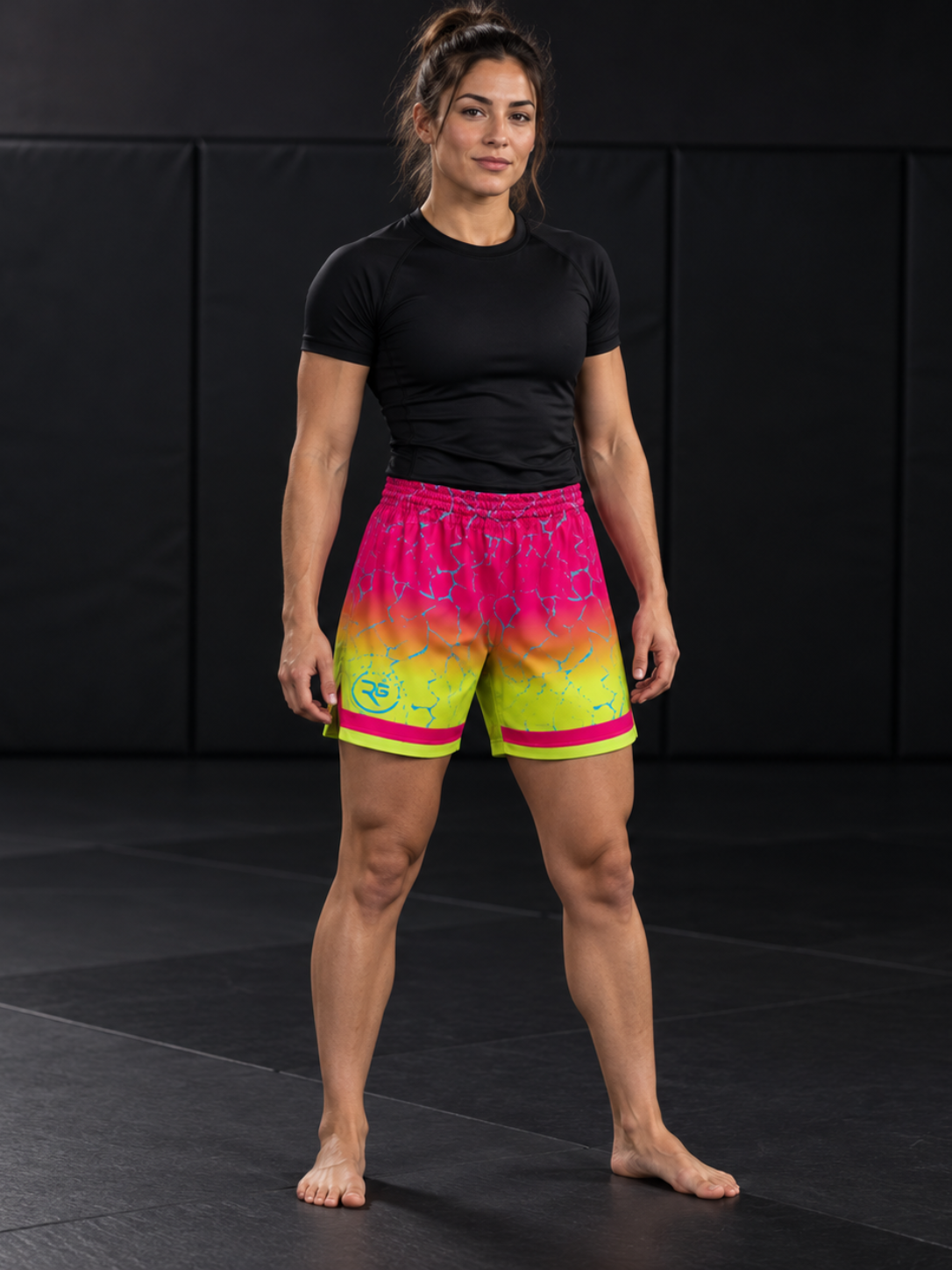 Roll Gear Neon Lava Grappling Shorts – Women's, woman standing on the mat, front view.