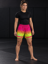 Roll Gear Neon Lava Grappling Shorts – Women's, woman standing on the mat, front view.