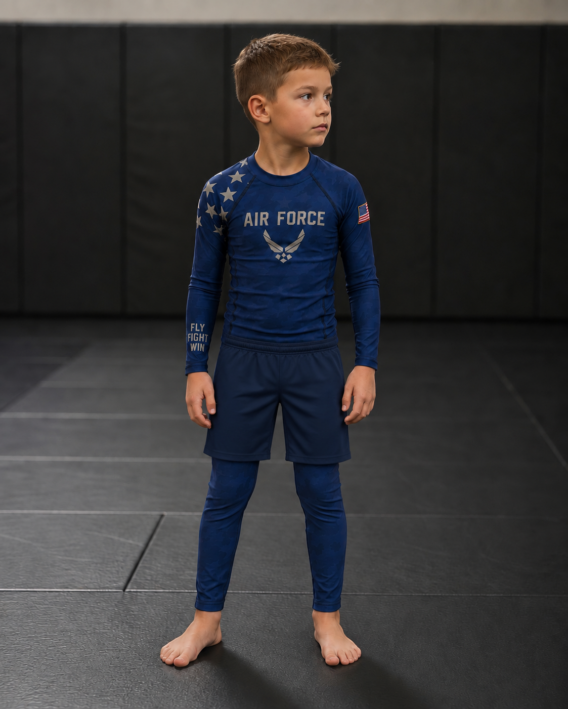 Roll Gear Kids Air Force Compression Spats – Navy, front view on a boy in the matching rash guard.