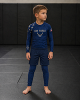 Roll Gear Kids Air Force Compression Spats – Navy, front view on a boy in the matching rash guard.