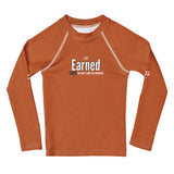 Roll Gear Earned Not Given Long Sleeve Rash Guard - Burnt Orange, Kids, front view.