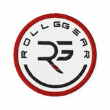 Embroidered patch with 'ROLLGEAR' logo on a dark blue background